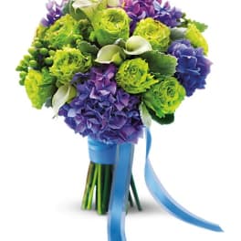 Bouquet of green and purple flowers with a blue ribbon wrap