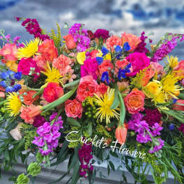 Bright mixed bouquet with roses, carnations, and yellow daisies