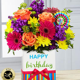 Colorful birthday flower arrangement in a gift box with roses and daisies