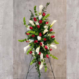 Tall standing floral spray with red roses and white calla lilies