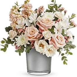 Blush and white floral arrangement in a clear glass vase