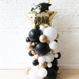 Graduation balloon arrangement with a star-shaped "Congrats Grad" balloon