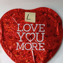 Red heart-shaped balloon with "LOVE YOU MORE" text