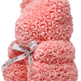 Stacked pink rose-shaped gift boxes tied with ribbon