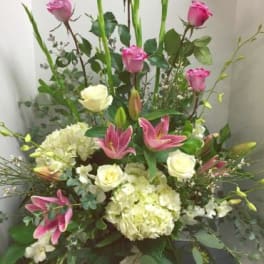 Tall bouquet with pink roses, lilies, and white hydrangeas