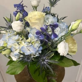 Bouquet of blue and white flowers in a vase