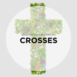 Floral cross arrangement with mixed pink, white, and purple blooms