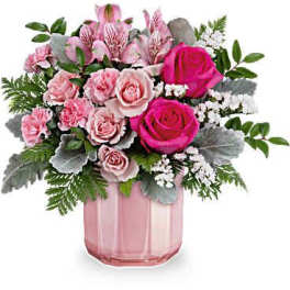 Pink roses and carnations in a pink glass vase
