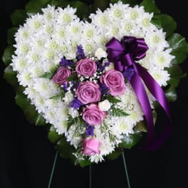 Heart-shaped floral spray with white chrysanthemums and pink roses