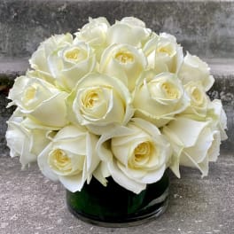 White rose bouquet in a dark glass vase