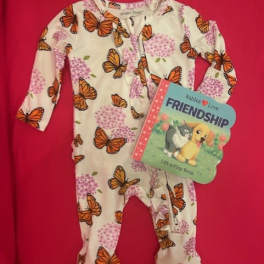 Baby onesie with butterfly print and a friendship board book