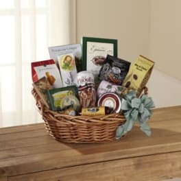 Gift basket filled with assorted packaged snacks and a ribbon bow