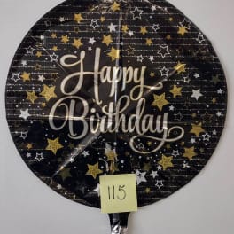 Round black birthday balloon with gold and white stars