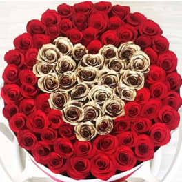 Heart-shaped bouquet of red and cream roses