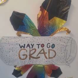 Rainbow graduation balloon with "Way to Go Grad" text