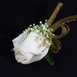 White rose boutonniere with baby's breath and gold ribbon