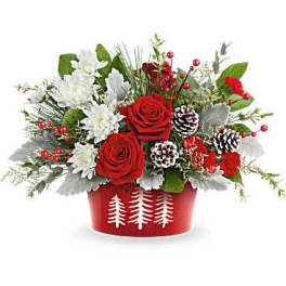Red roses and white flowers in a red holiday container