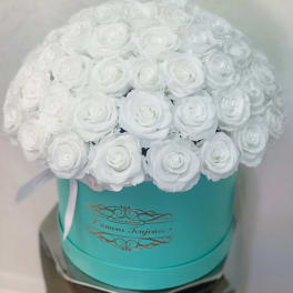 White rose bouquet in a turquoise hat box with a ribbon