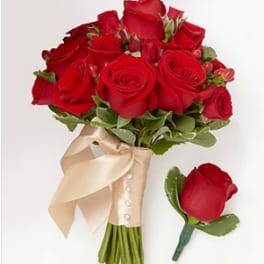 Red rose bouquet with a satin ribbon and matching boutonniere