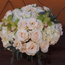 Cream rose and white hydrangea bouquet with green orchids