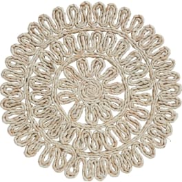 Round woven straw placemat with a floral pattern