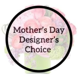 Pastel pink and lavender mixed flower arrangement in a light green cube vase with Mother’s Day text overlay.