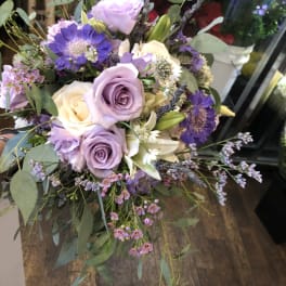 Lavender and white rose bouquet with purple accent flowers