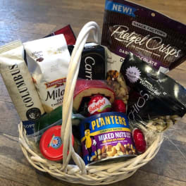 Basket of assorted snack packages and candy