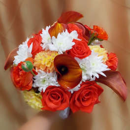 Bouquet of red roses, white daisies, and orange calla lilies
