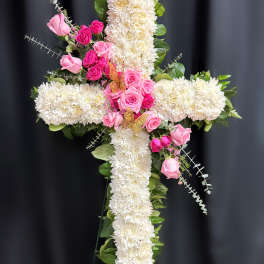 Cross-shaped floral arrangement with white chrysanthemums and pink roses