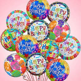 Bouquet of colorful round Happy Birthday foil balloons on strings