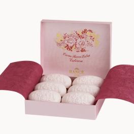 Pink gift box with six white oval soaps