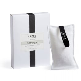 White boxed candle set with a fabric sachet labeled Lafco New York