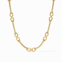 Gold chain necklace with linked circular accents on a white background