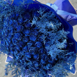 Bouquet of blue roses with airy blue filler