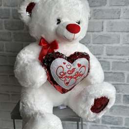 White teddy bear holding a heart with red sequins and "Love You" text