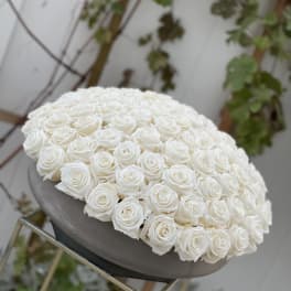 Large dome of white roses on a pedestal stand