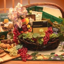 Gift basket with chocolates, snacks, and a candle