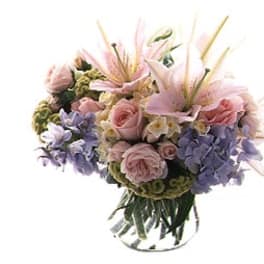 Pink and lavender bouquet in a clear glass vase