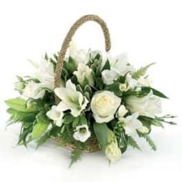 White floral basket arrangement with roses and lilies