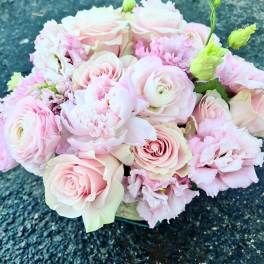 Bouquet of pale pink roses and ruffled pink flowers