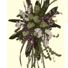 Tall floral arrangement with white and purple blooms