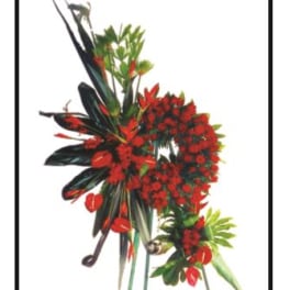 Red tropical floral arrangement with long dark leaves