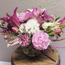 Pink and white mixed bouquet in a clear glass vase