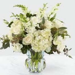 White floral bouquet in a clear glass vase