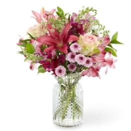Pink and white mixed bouquet in a clear glass vase