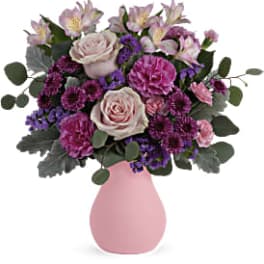 Pink and purple mixed bouquet in a pink vase