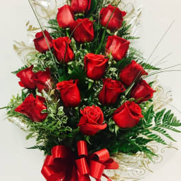 Tall bouquet of red roses with a red ribbon bow