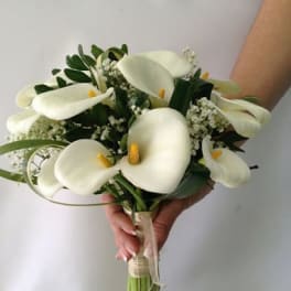Bouquet of white calla lilies with greenery and baby's breath