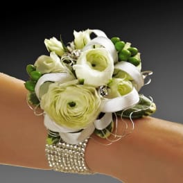 White floral wrist corsage with ribbon and rhinestone bracelet